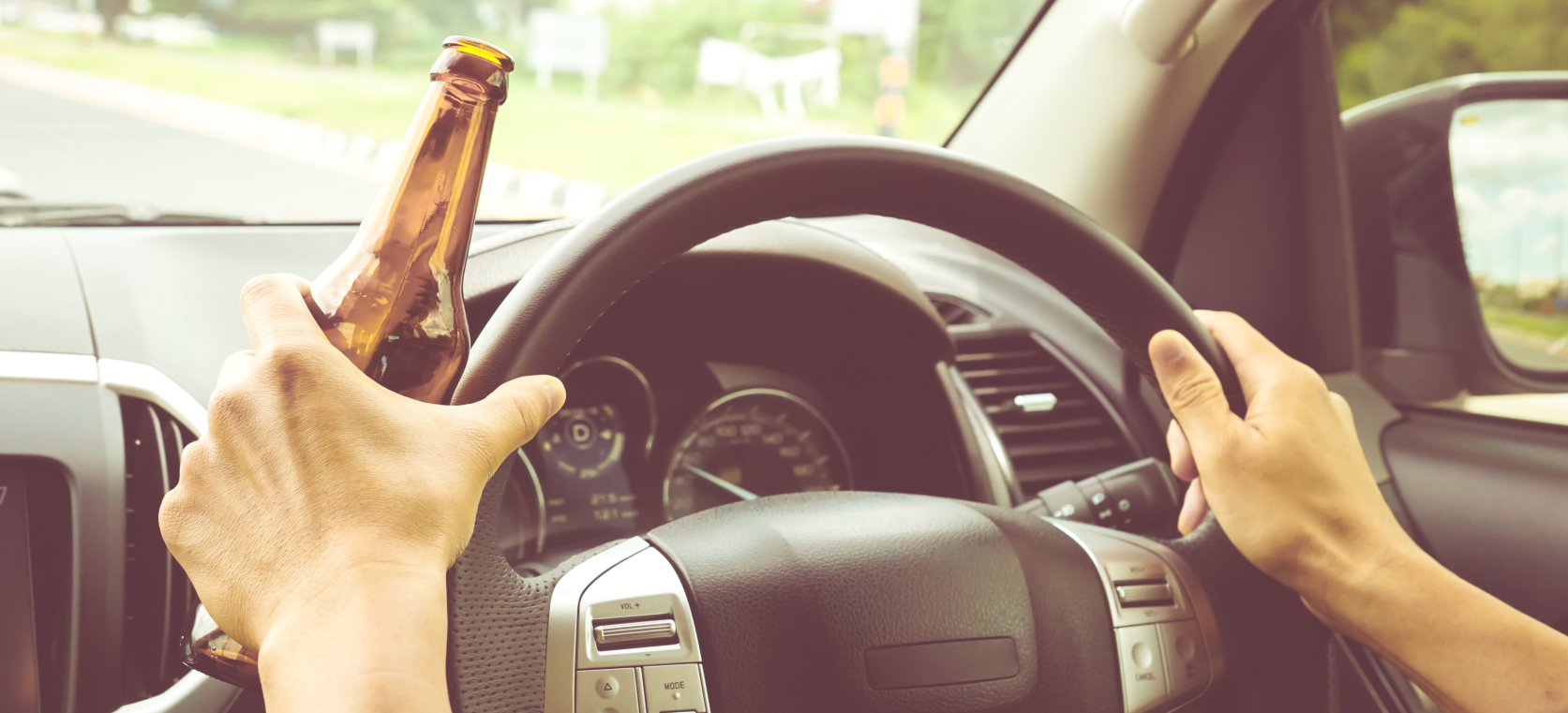 driving while holding a beer